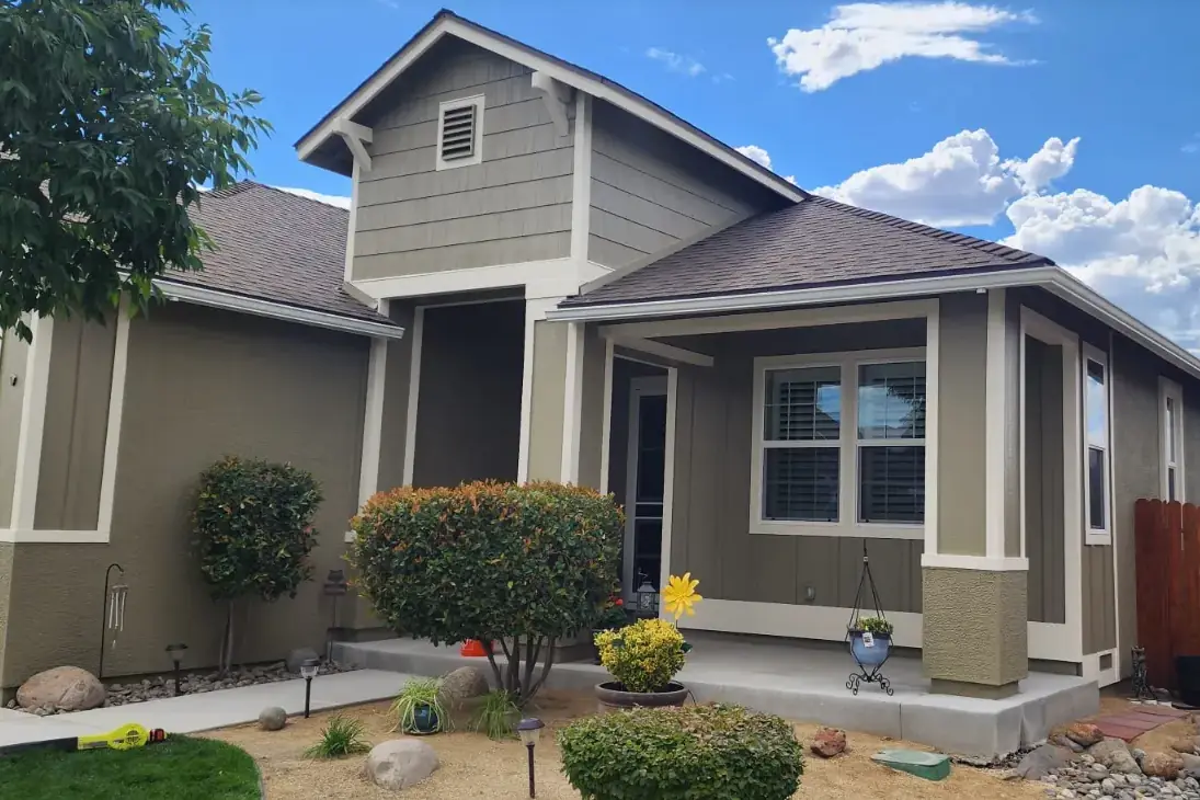 Craftsman-style home painted in olive and tan with crisp white trim